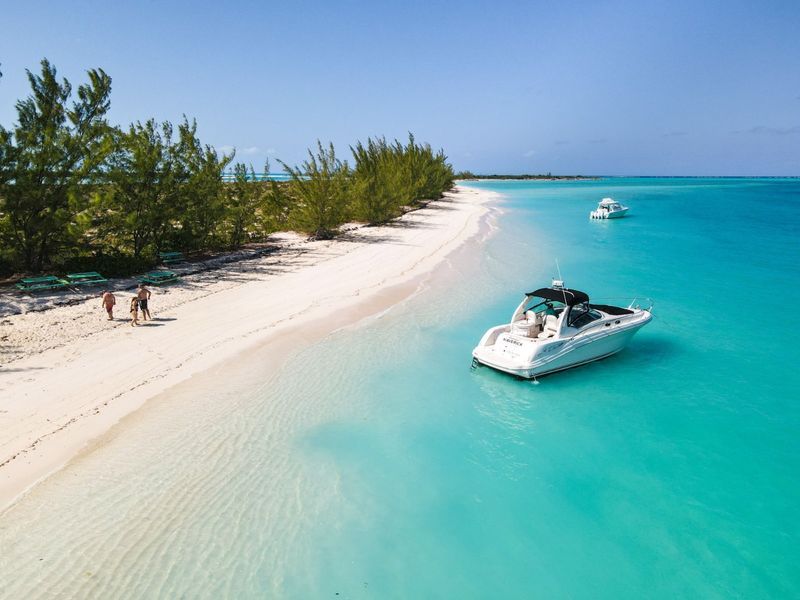 charter-boat-people-on-beach
